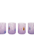 Four small clear glass tumblers with a lavender-purple gradient and white marbled swirls, decorated with small colorful evil eye motifs, shown on a plain white background.