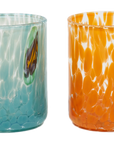 Four hand-blown glass tumblers with textured, bubbly patterns in yellow, teal, orange, and lavender, each featuring a small hand-painted butterfly detail, shown against a plain white background.