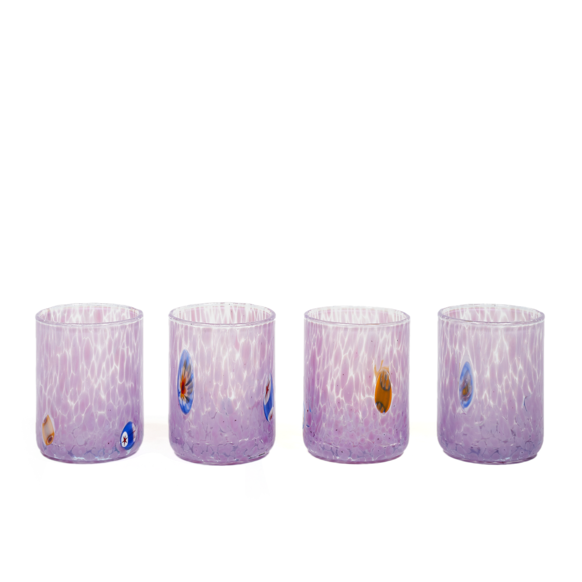 Four small clear glass tumblers with a lavender-purple gradient and white marbled swirls, decorated with small colorful evil eye motifs, shown on a plain white background.