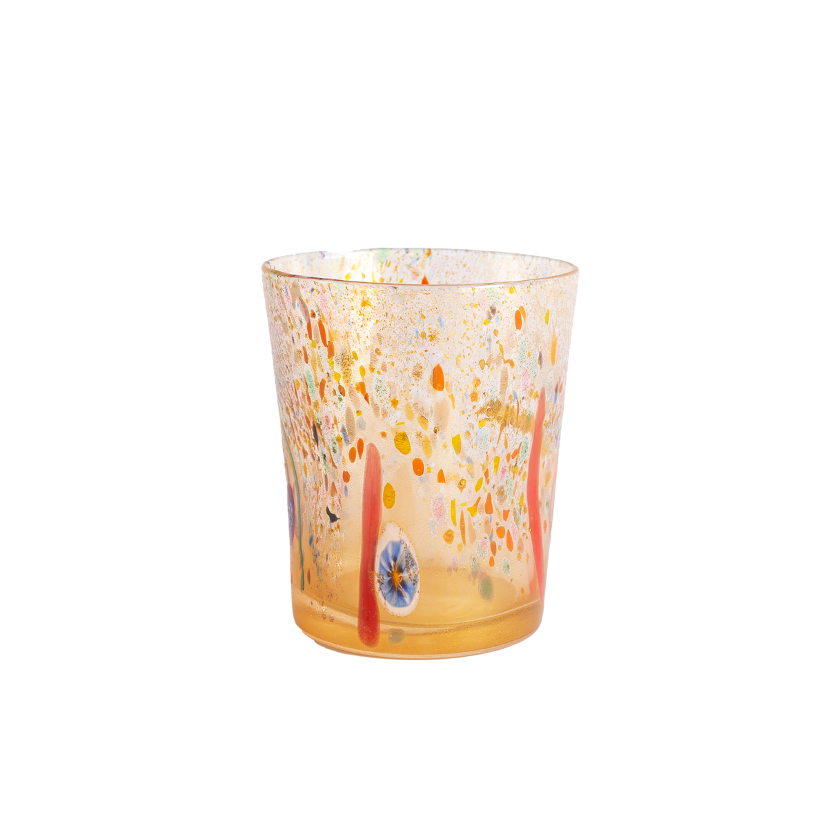 A clear glass tumbler with a warm amber base and multicolored hand-blown speckles in orange, yellow, red, and blue, isolated on a white background.