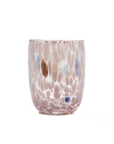 A hand-blown glass tumbler with a textured, bubbly pattern in shades of dusty pink, lavender, and white, accented with small blue and brown bubbles, set against a plain white background.